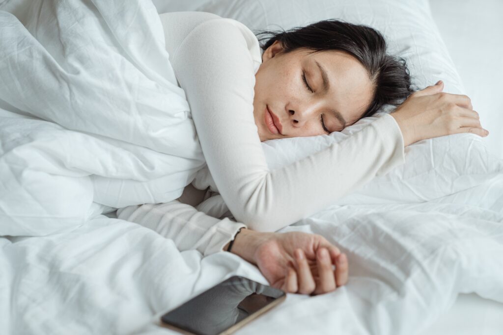 Lady sleeping on fluffy pillow