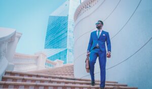 A CEO standing proudly outside an office building